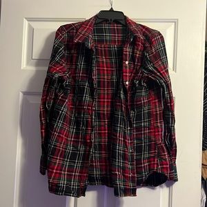 green, black, and red button down flannel